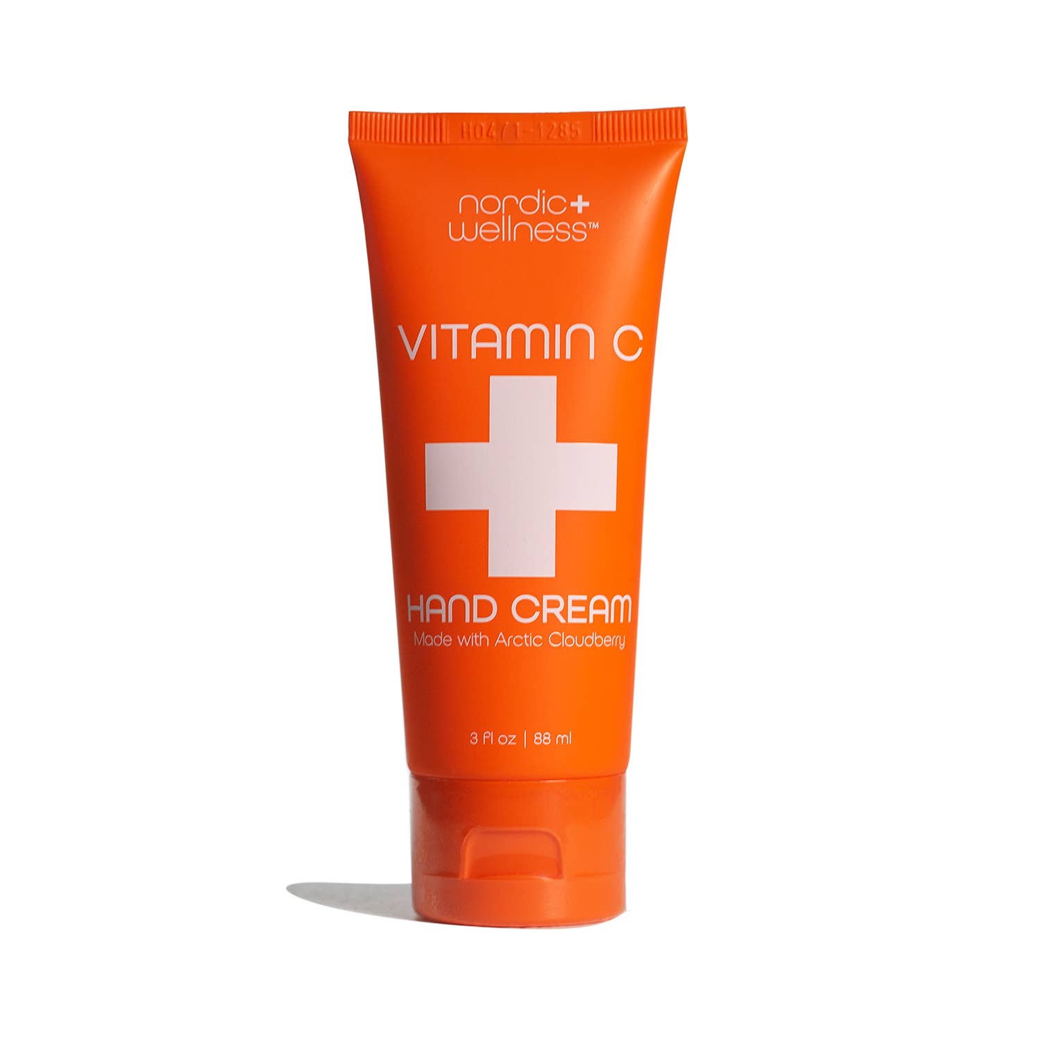 Nordic Wellness Vitamin C Hand Cream, 3 fl oz, comes in an orange tube with a white cross and is formulated with Arctic Cloudberry Oil and enriched with shea butter for superior nourishment.