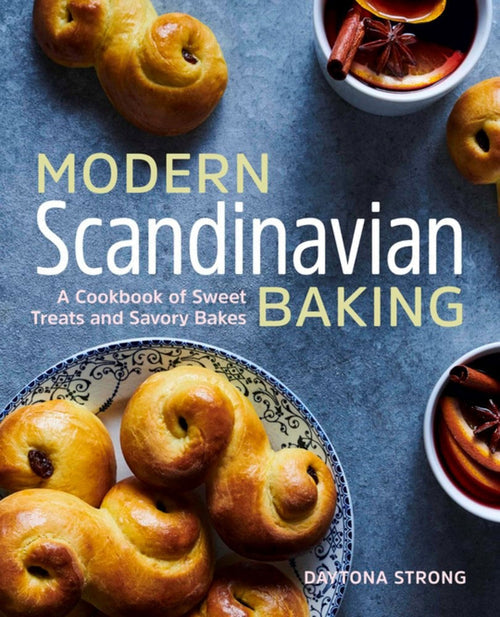 Cover of the book "Modern Scandinavian Baking," authored by Daytona Strong, showcasing delightful Scandinavian recipes such as saffron buns and spiced drinks on a dark surface.