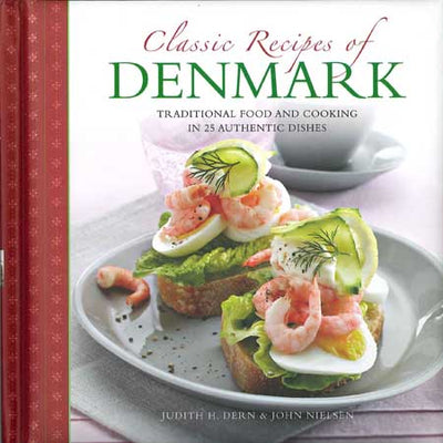 Book titled Classic Recipes of Denmark: Traditional Food 25 Dishes features Danish cuisine, including open-faced sandwiches with shrimp, cucumber, and dill. Ideal for traditional recipe enthusiasts.