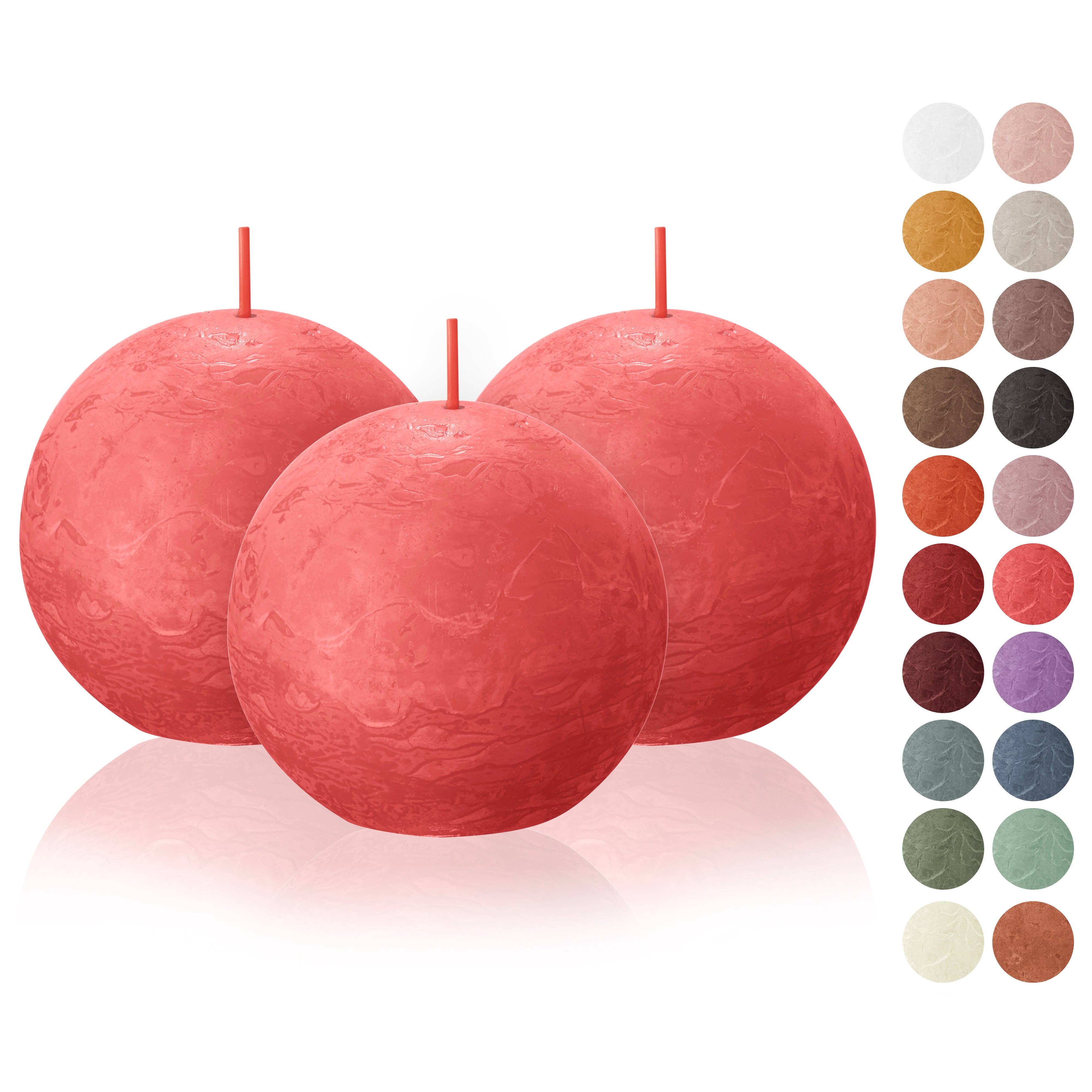 Displayed are three large, rustic ball candles in vibrant blossom pink, crafted from eco-friendly plant-based wax. To the right, a selection of smaller color samples complements these unscented and dripless beauties.