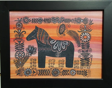 Framed print titled Dala Horse with White Flowers by Heidi Lange, featuring a stylized black Dala Horse with intricate patterns, surrounded by floral designs on an orange gradient background. Size: 11x14.