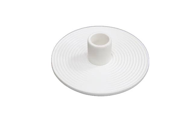 A modern white porcelain taper holder featuring a circular design with a raised central cylinder and concentric ridges, ideal for tabletop decoration at wedding events.