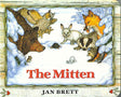Illustrated board book cover of Mitten by Jan Brett, inspired by a Ukrainian folk tale, with animals like a bear, owl, rabbit, fox, badger, and a cozy mitten in the snow.