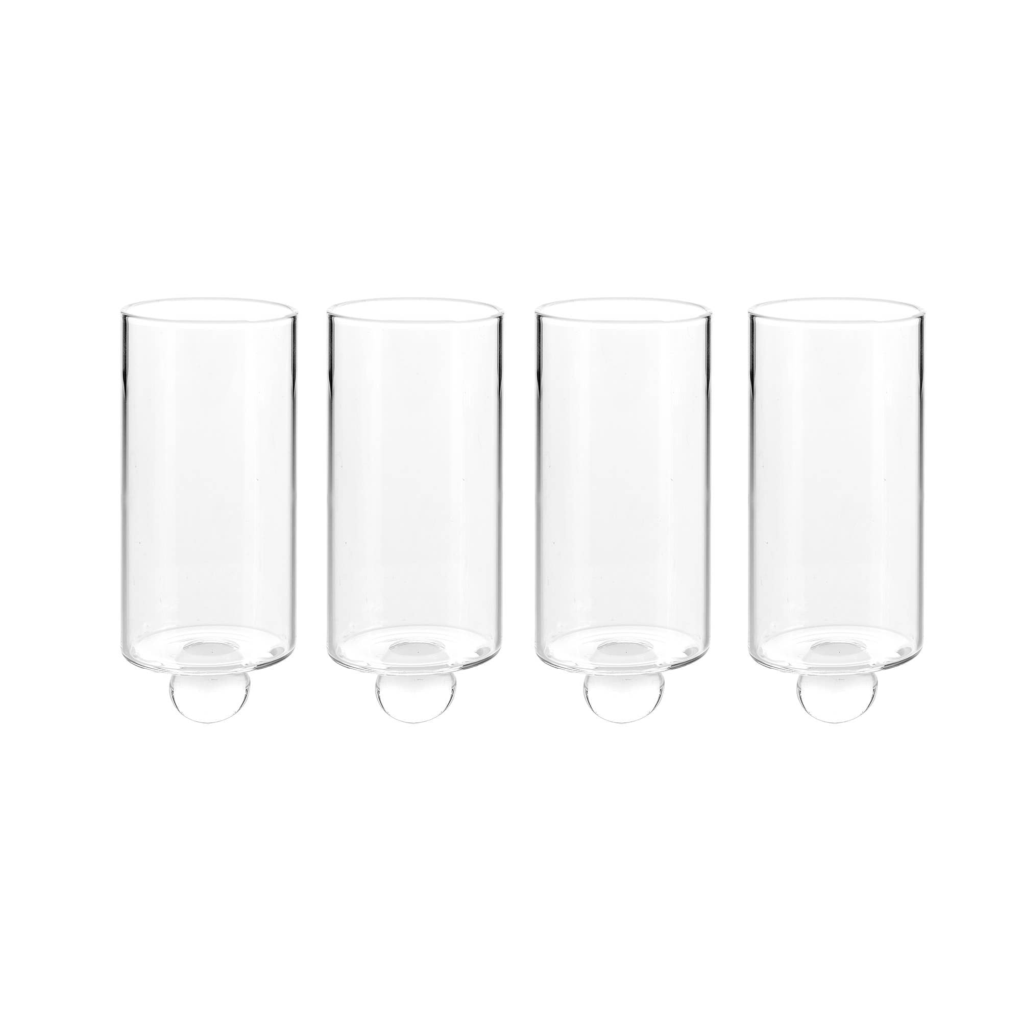 A set of four sophisticated clear glass cylinders, each with a small circular base, perfectly aligned in a row against a simple background and adaptable as candle holders or mini vases to enhance your decor.