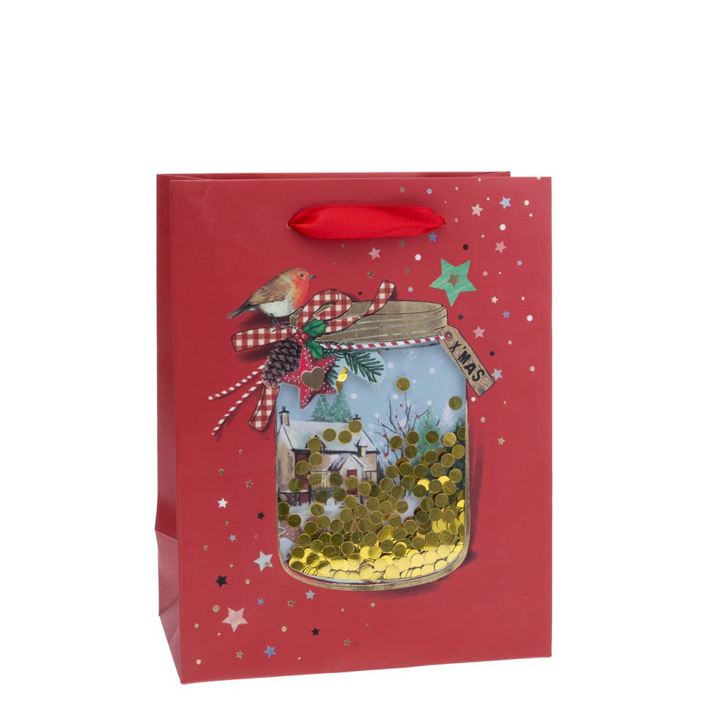 Festive Christmas gift bag featuring a medium-sized jar with a robin, pinecones, an Xmas tag, and filled with shimmering gold confetti.