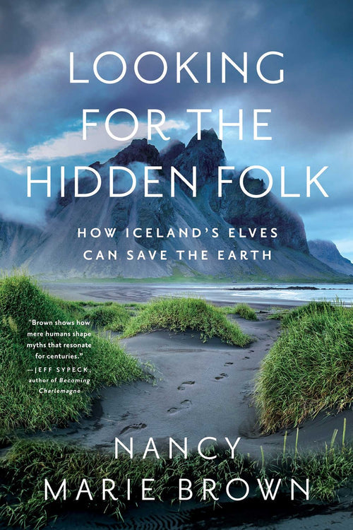 Book cover of *Looking for the Hidden Folk: How Iceland's Elves Can Save the Earth* by Nancy Marie Brown, featuring a captivating Icelandic landscape with grassy dunes and a mountainous backdrop under a cloudy sky, suggesting the mysterious presence of elves interwoven with nature.