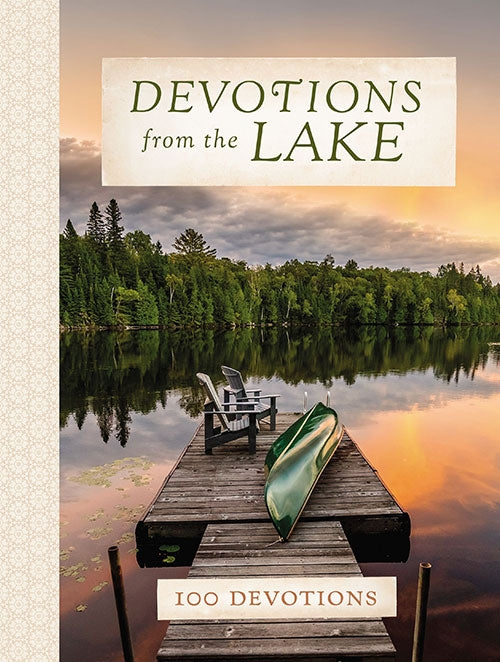 The book, *Devotions from the Lake: 100 Devotions by Betsy Painter*, features a cover showcasing a dock with chairs and a canoe amidst a tranquil lake and forest scene, inviting readers to embrace life's relaxing pace through its uplifting devotions.